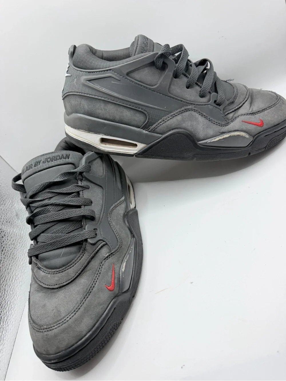 Jordan Kids Gray Sneakers with Red Swoosh